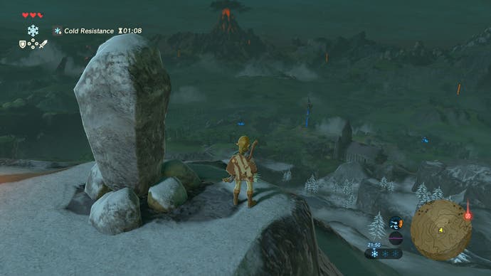 A screenshot from The Legend of Zelda: Breath of the Wild, showing Link looking down from a mountain top at night
