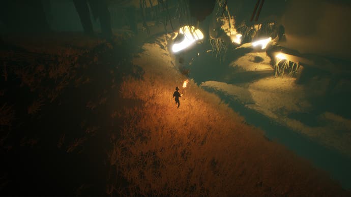 A screenshot from Chasing the Unseen, showing the player exploring caves with a torch.