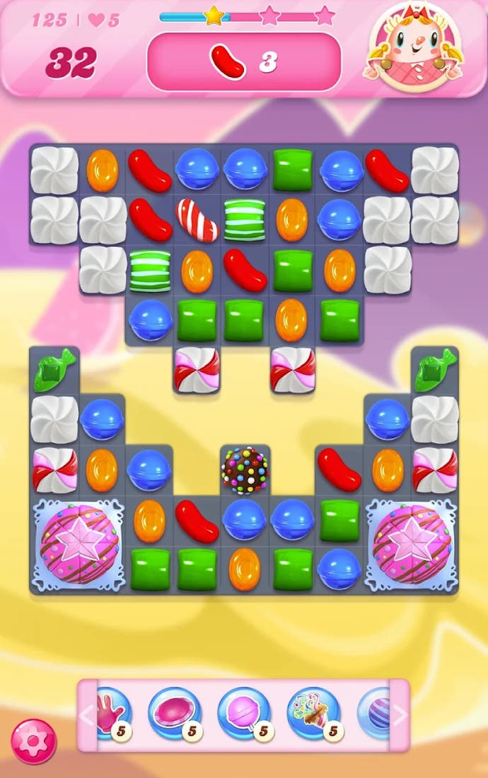 A screenshot of Candy Crush Saga showing various shapes over pink and yellow background