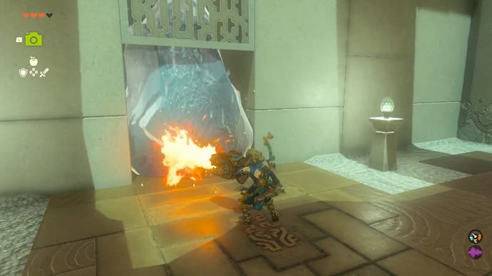 Zelda Tears of the Kingdom, Link using a Flame-Emitter Shield to melt a block of ice blocking a doorway