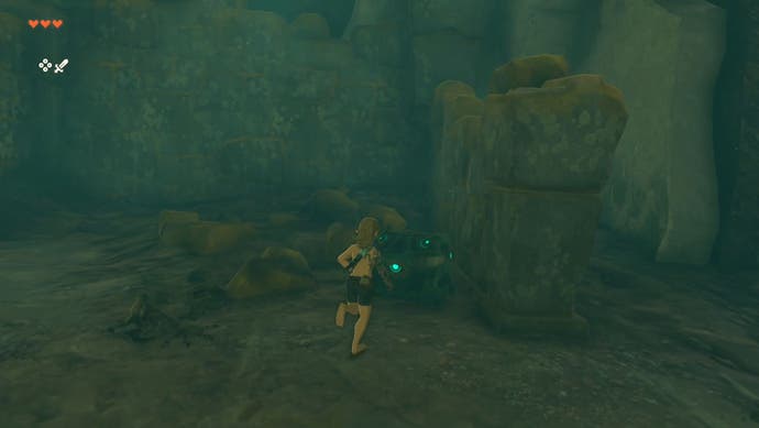 Link approaching a treasure chest that's located beneath Hyrule Castle in The Legend of Zelda: Tears of the Kingdom.