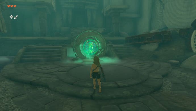Link standing near a mysterious, glowing green circle with a hand symbol in The Legend of Zelda: Tears of the Kingdom.