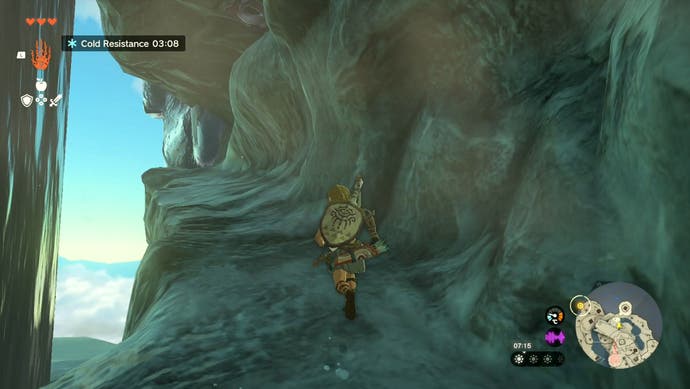 Image taken from The Legend of Zelda: Tears of the Kingdom showing Link running along a narrow, rocky path behind a waterfall.