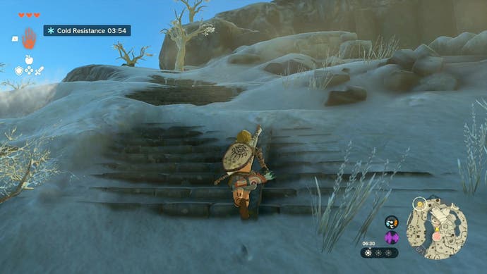 Image showing Link on a snowy, rocky set of stairs as the player heads to the Gutanbac Shrine in The Legend of Zelda: Tears of the Kingdom.