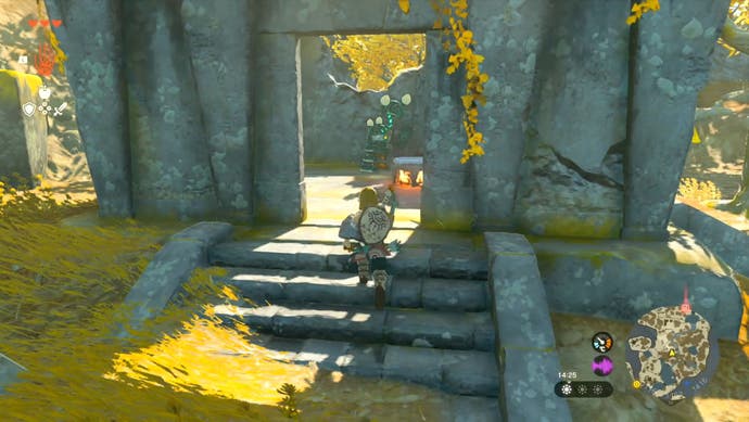Link approaching a stone building as he journeys to the In-Isa Shrine in The Legend of Zelda: Tears of the Kingdom.