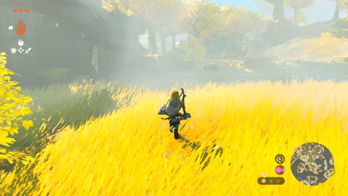 Link running through long, golden grass as he makes his way to the In-Isa Shrine in The Legend of Zelda: Tears of the Kingdom.